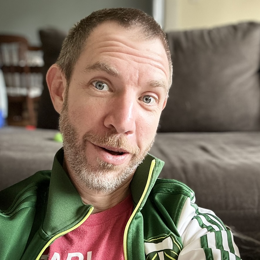 Selfie photo of a man making a funny face.