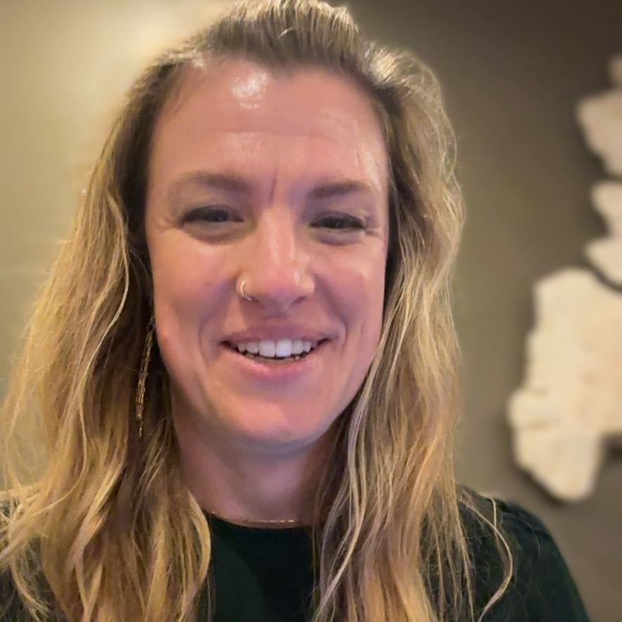 Selfie photo of a woman smiling.